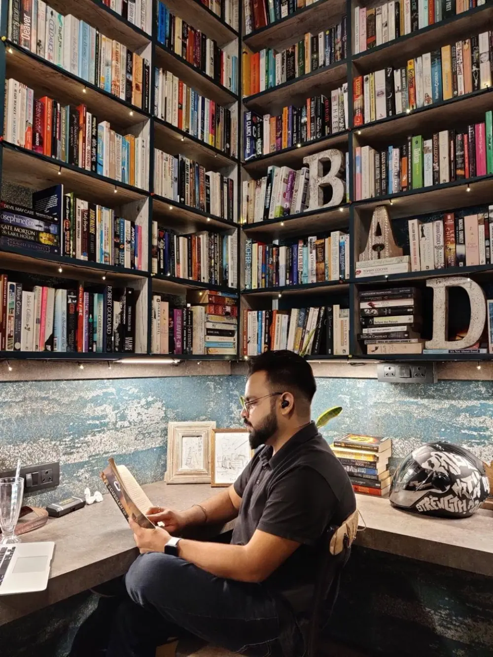 Harshit Bhatia, writing therapist, reading at his desk